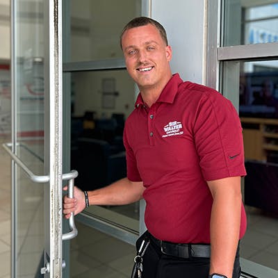 salesmen opening a door