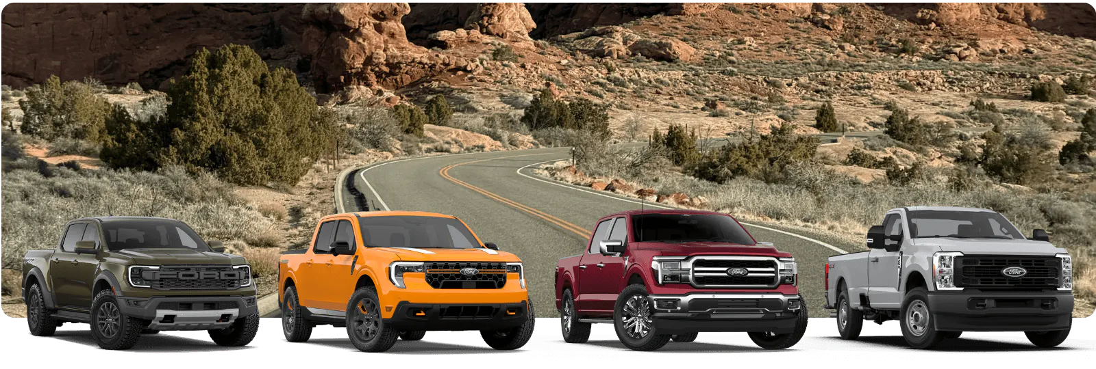 Four Ford trucks — Ranger Raptor, Maverick, F-150, and Super Duty on a desert highway
