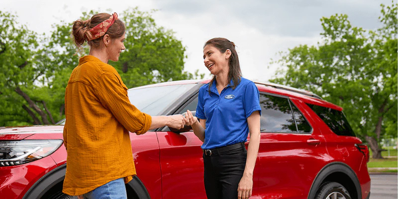 A ford representative shaking hand with a customer