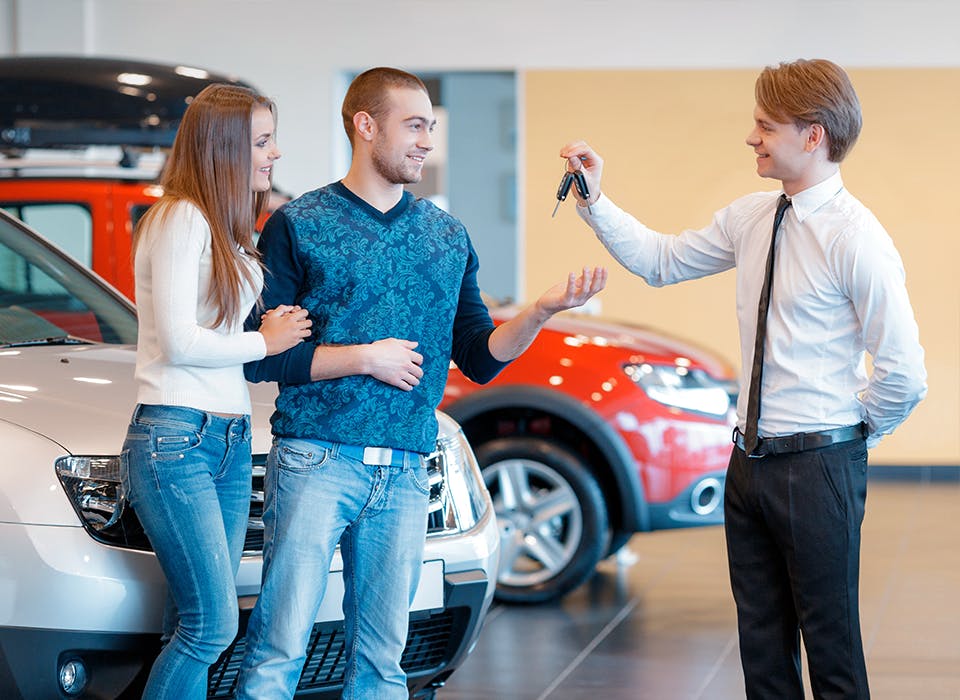 Couple receiving car keys