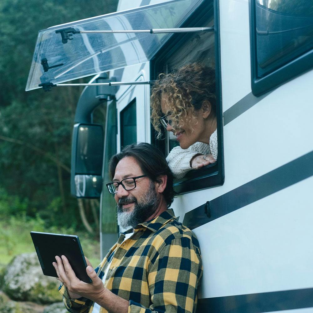 happy-adult-couple-and-their-rv