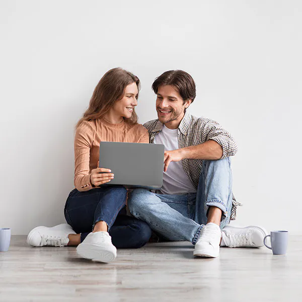 man and woman on a laptop
