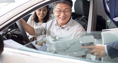 a senior couple looking to purchase a pre-owned vehicle