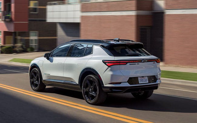 white chevy SUV on the road
