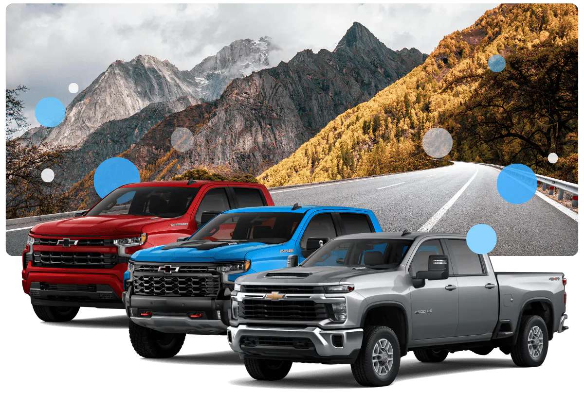 Three chevrolet truck for sale being displayed in a nature background