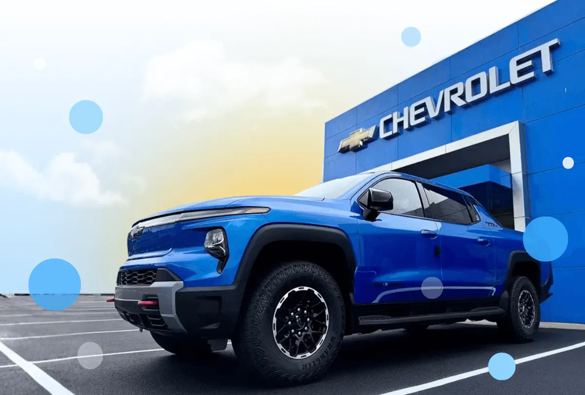 exterior strosnider chevrolet dealership showcasing a blue chevy pickup