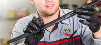Toyota mechanic inspecting wipers