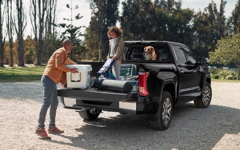 a father and daughter and their Toyota truck